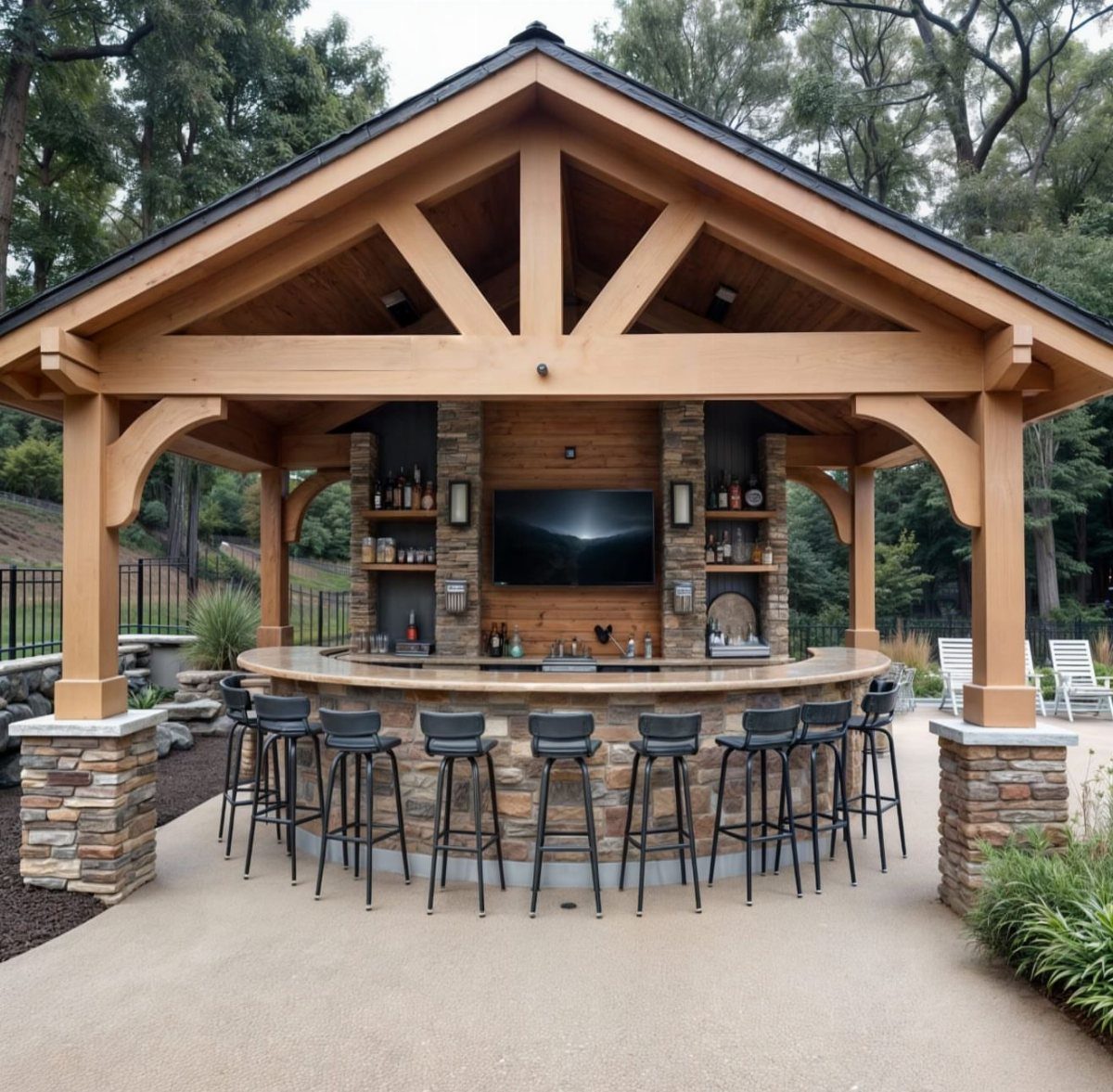 A curved outdoor bar with stone masonry and black stools under a wooden pavilion structure.