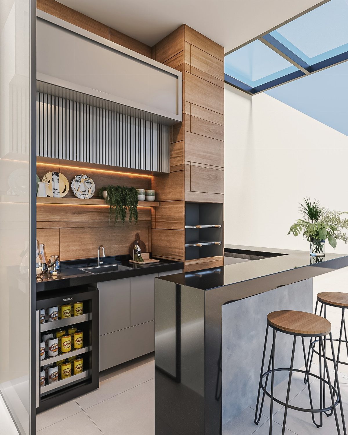 Modern outdoor kitchen with wooden accents, black countertops, and warm under-shelf lighting.