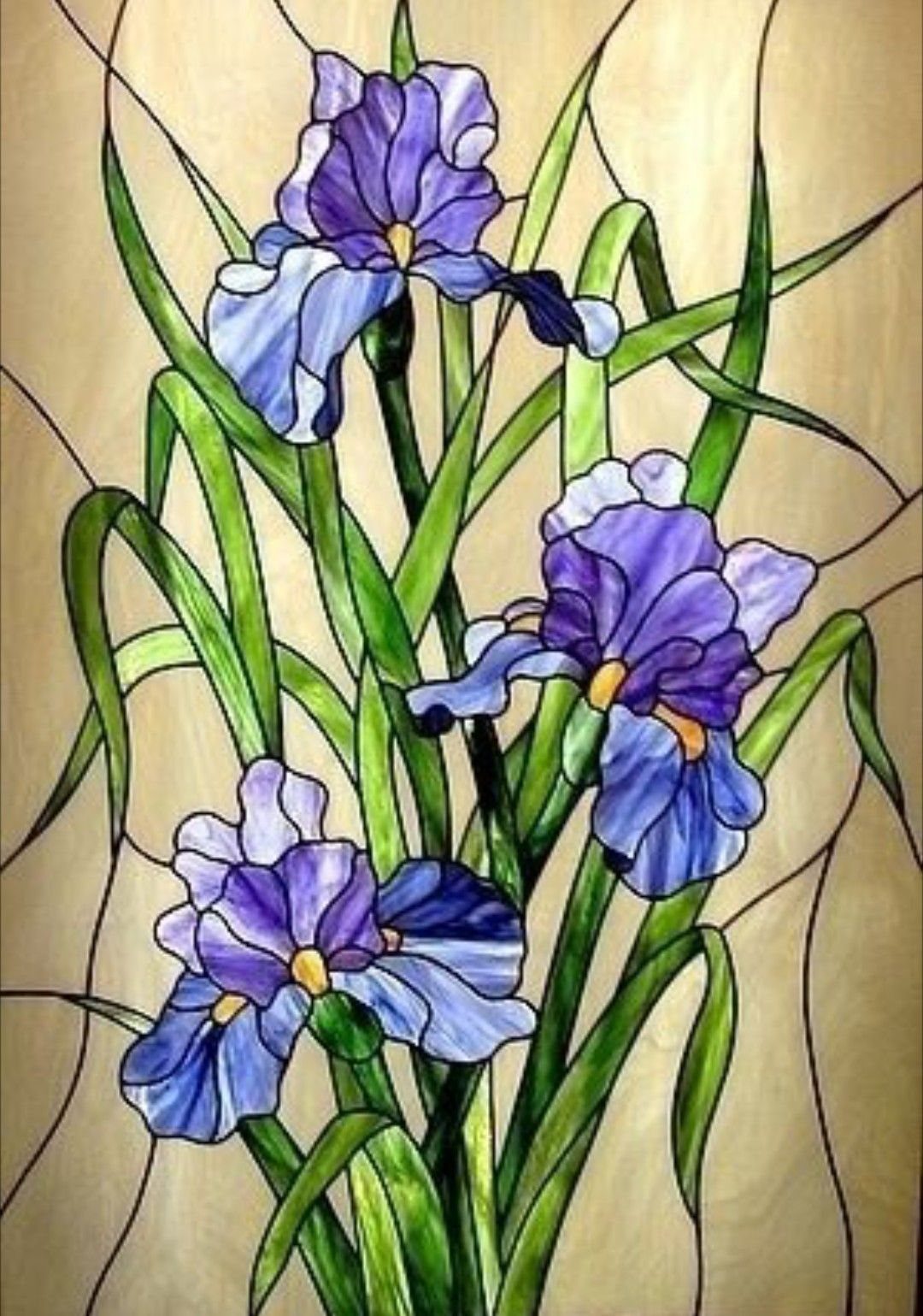 Colorful Stained Glass Design: 10 Ideas to Light a Room 6 Purple and blue iris flowers with green leaves in a stained glass design.