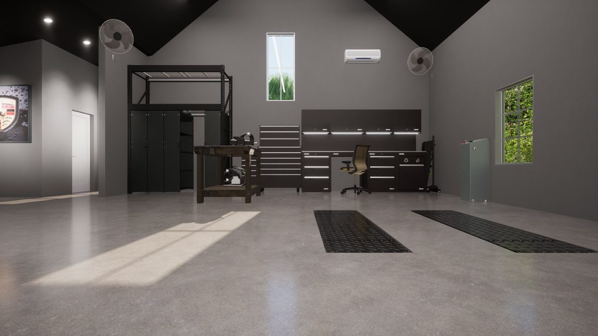 A modern garage workshop featuring a dark workbench, desk with chair, and organized storage cabinets.
