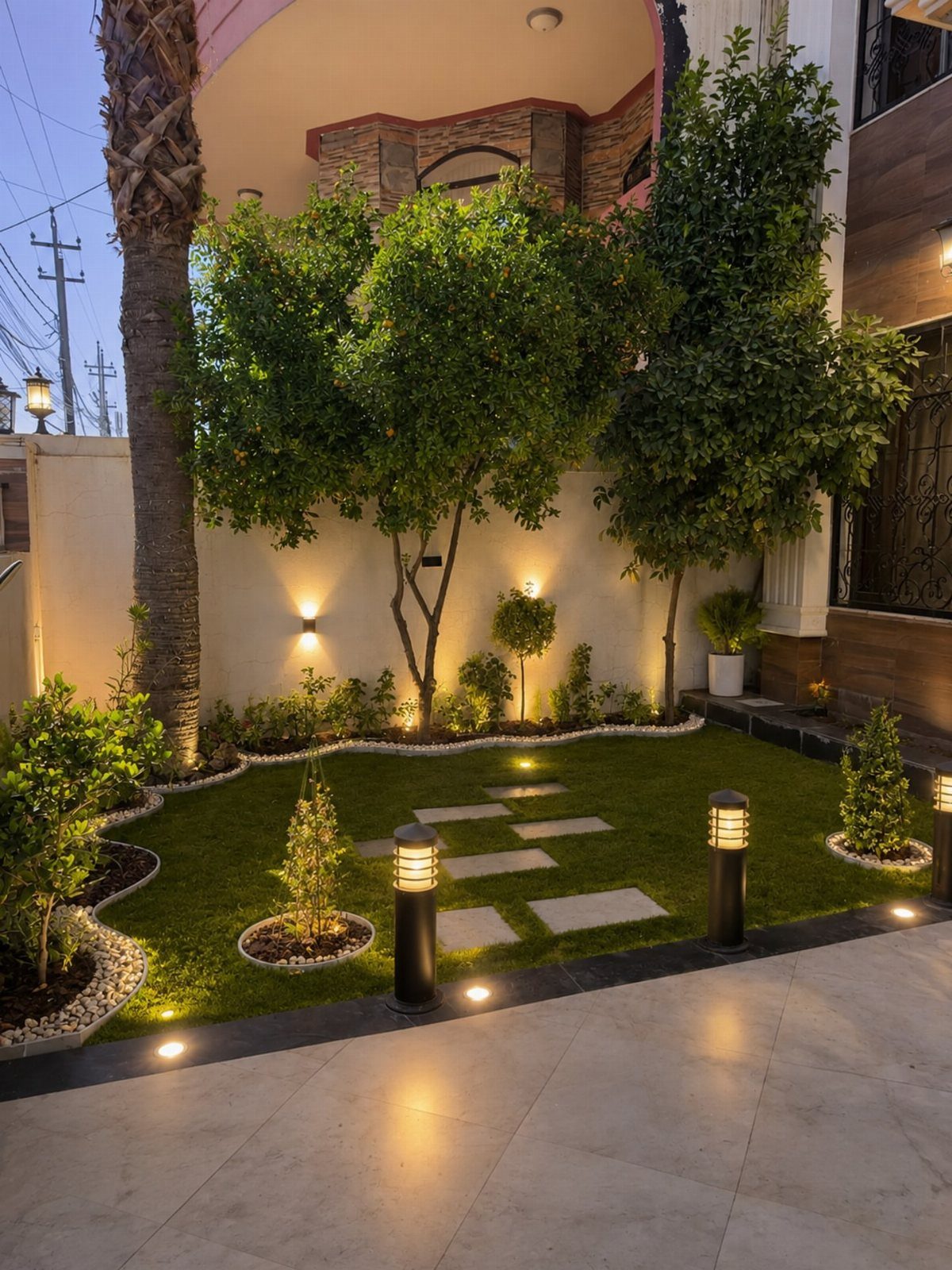 21 Home Decor Ideas for Garden Spaces That Work in Any Yard 3 Small landscaped garden with bollard lights and ground lighting illuminating green grass and shrubs.