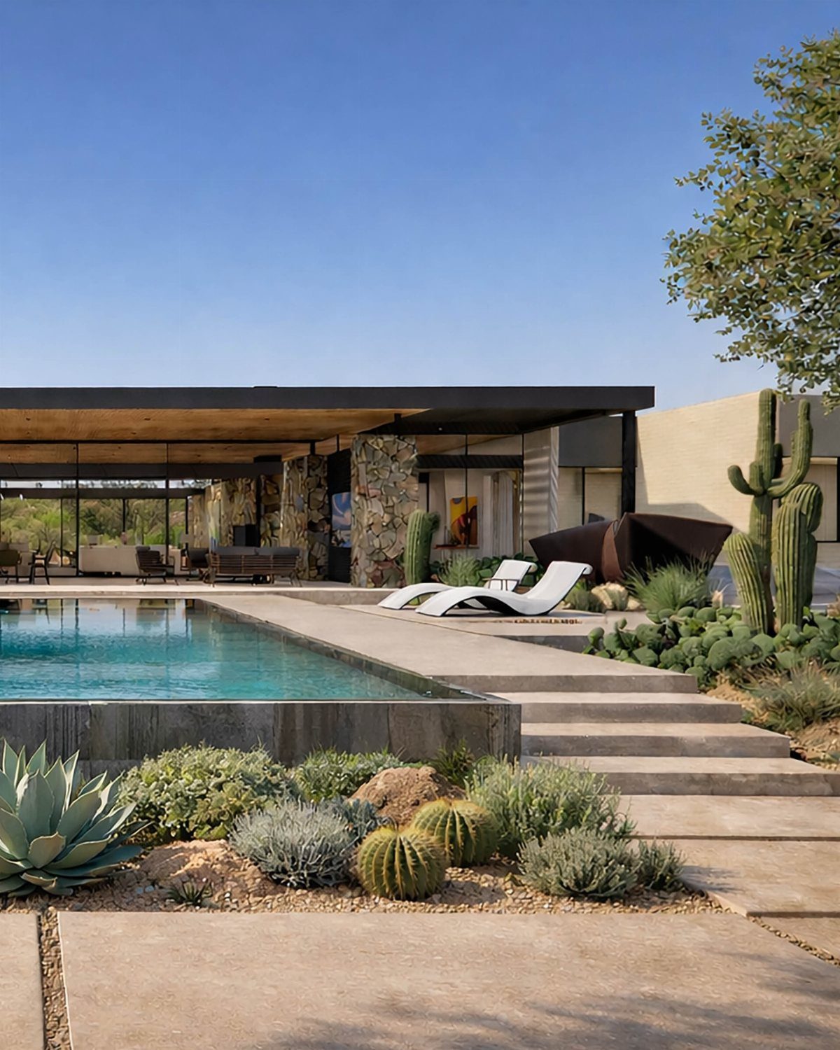Pool Deck Ideas: 20 Designs From Breeze Blocks to Mountain Views 13 Modern swimming pool with white lounge chairs and desert landscaping under a clear blue sky.